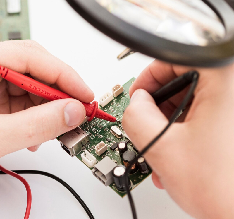 Tech Tunnel engineers working on IT infrastructure and electronics